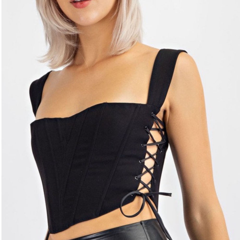 Black corset. Size large. Tie up sides. NWT.